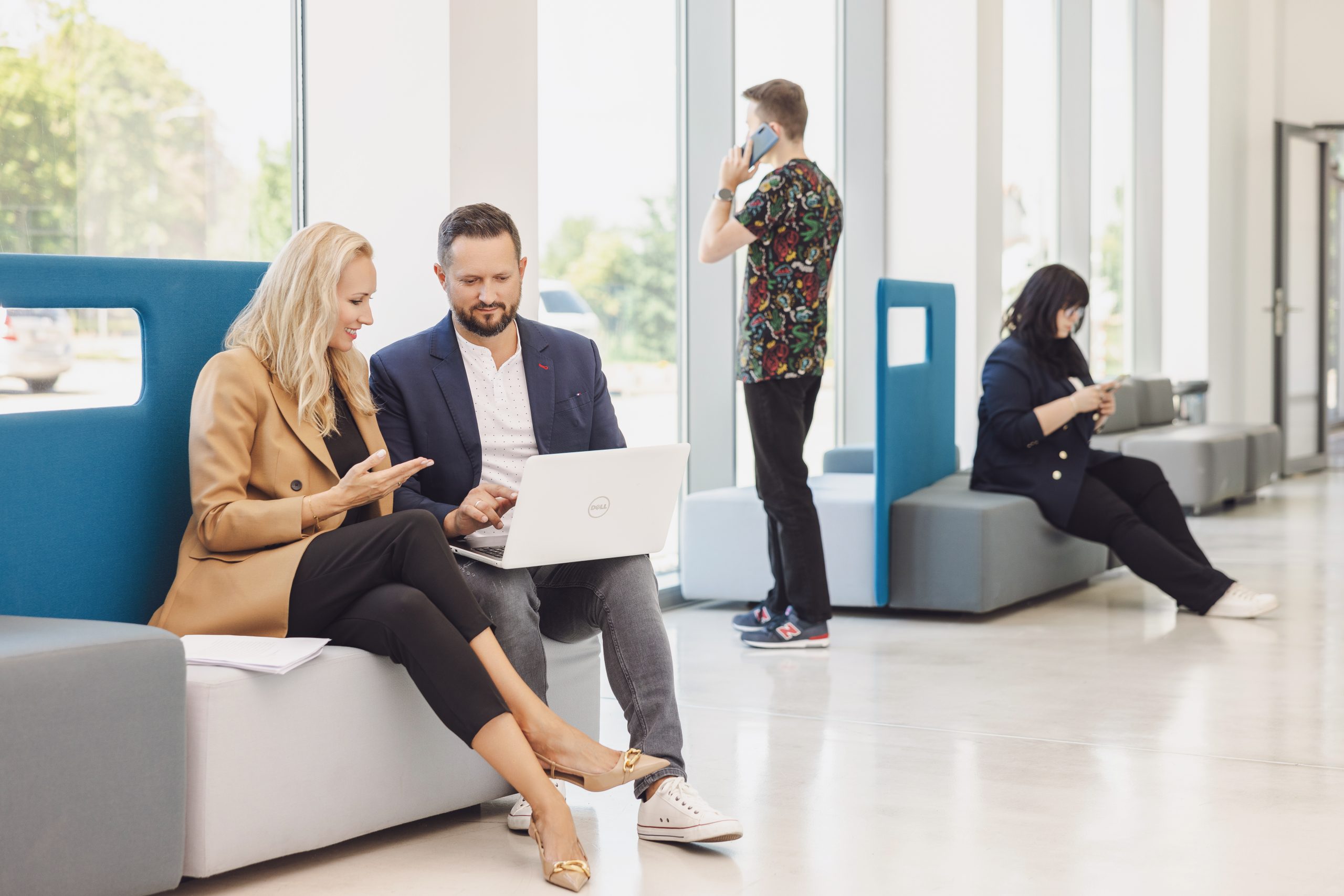 people sitting in front of a laptop with data governance tools