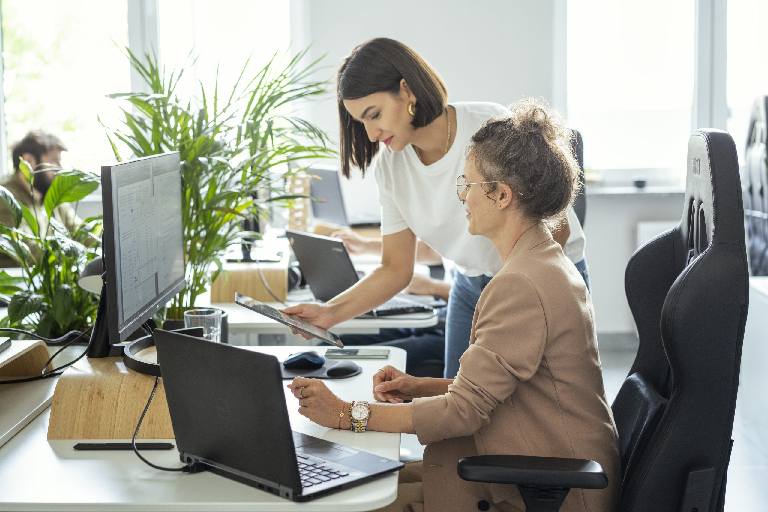 two women working on IT staff augmentation services
