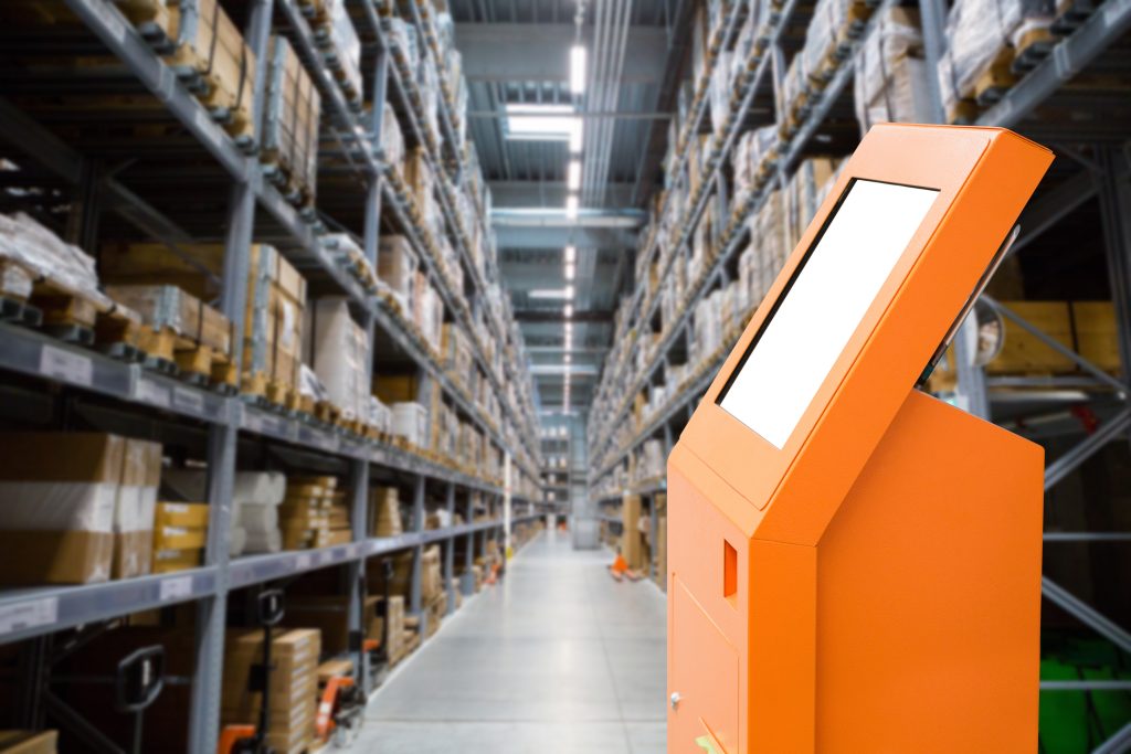 Self-service desk in a warehouse with logistics software development tool implemented