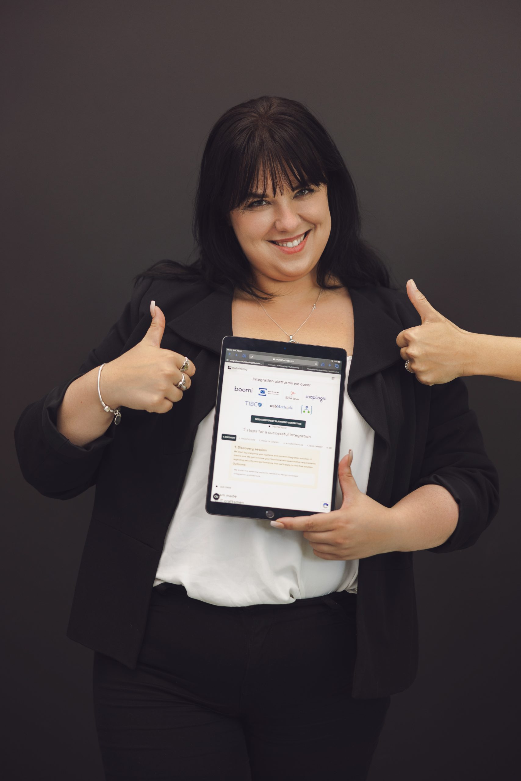 woman with a tablet working on a Boomi Salesforce integration project